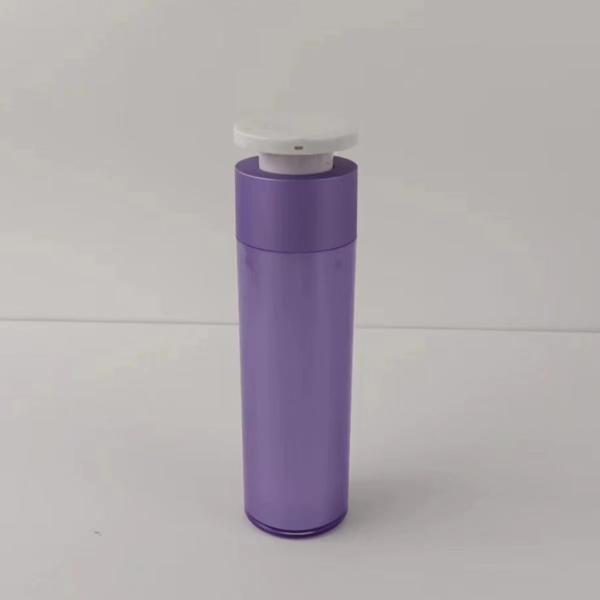 Purple Plastic Cosmetic Dispenser Bottle with White Push Down Press Pump